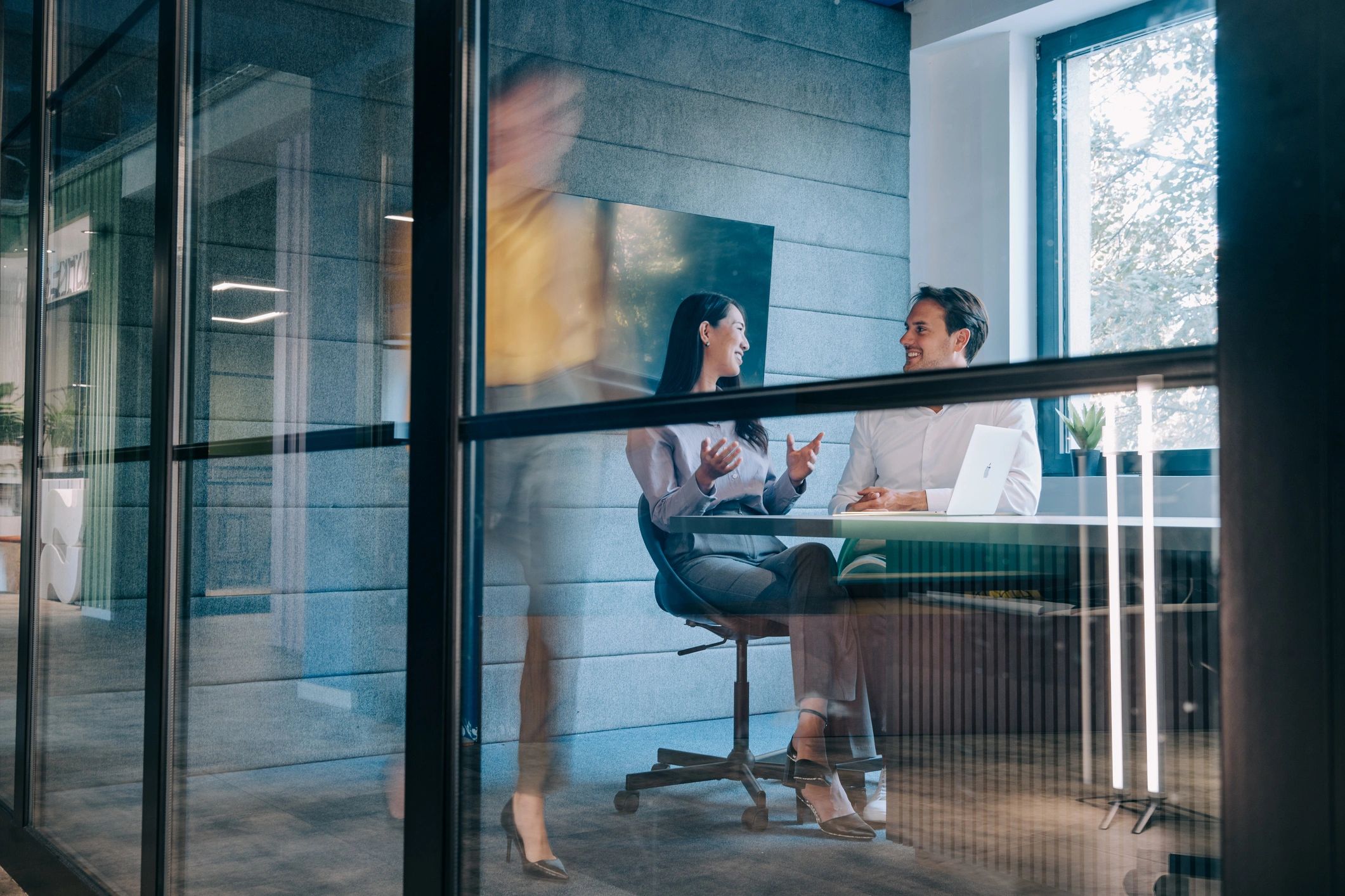 Modern office with blue and green accents, representing risk advisory consulting